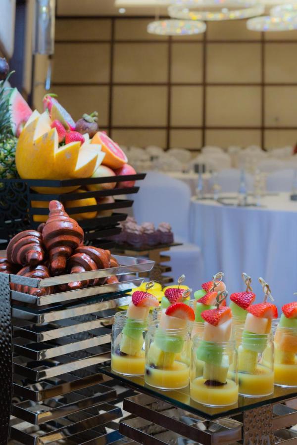 Dusitd2 Salwa Doha Hotel Exterior photo Fruit and pastry
