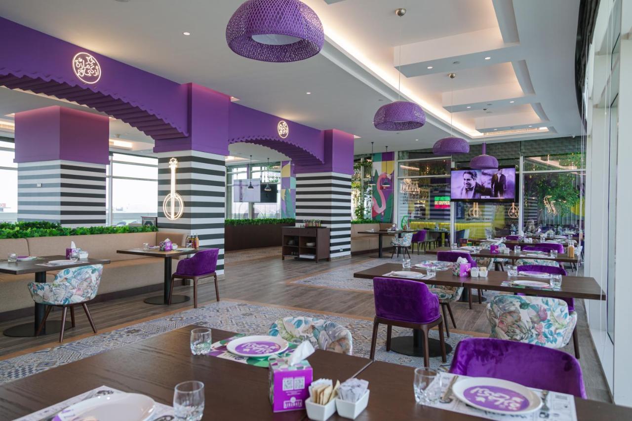 Dusitd2 Salwa Doha Hotel Exterior photo Interior of a Pizza Hut restaurant in Malaysia