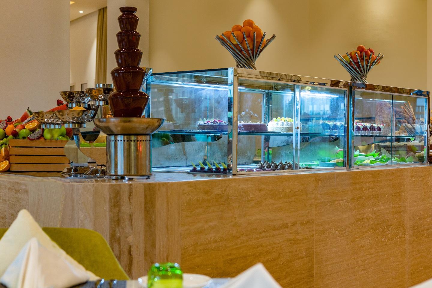 Dusitd2 Salwa Doha Hotel Exterior photo A dessert counter at a hotel